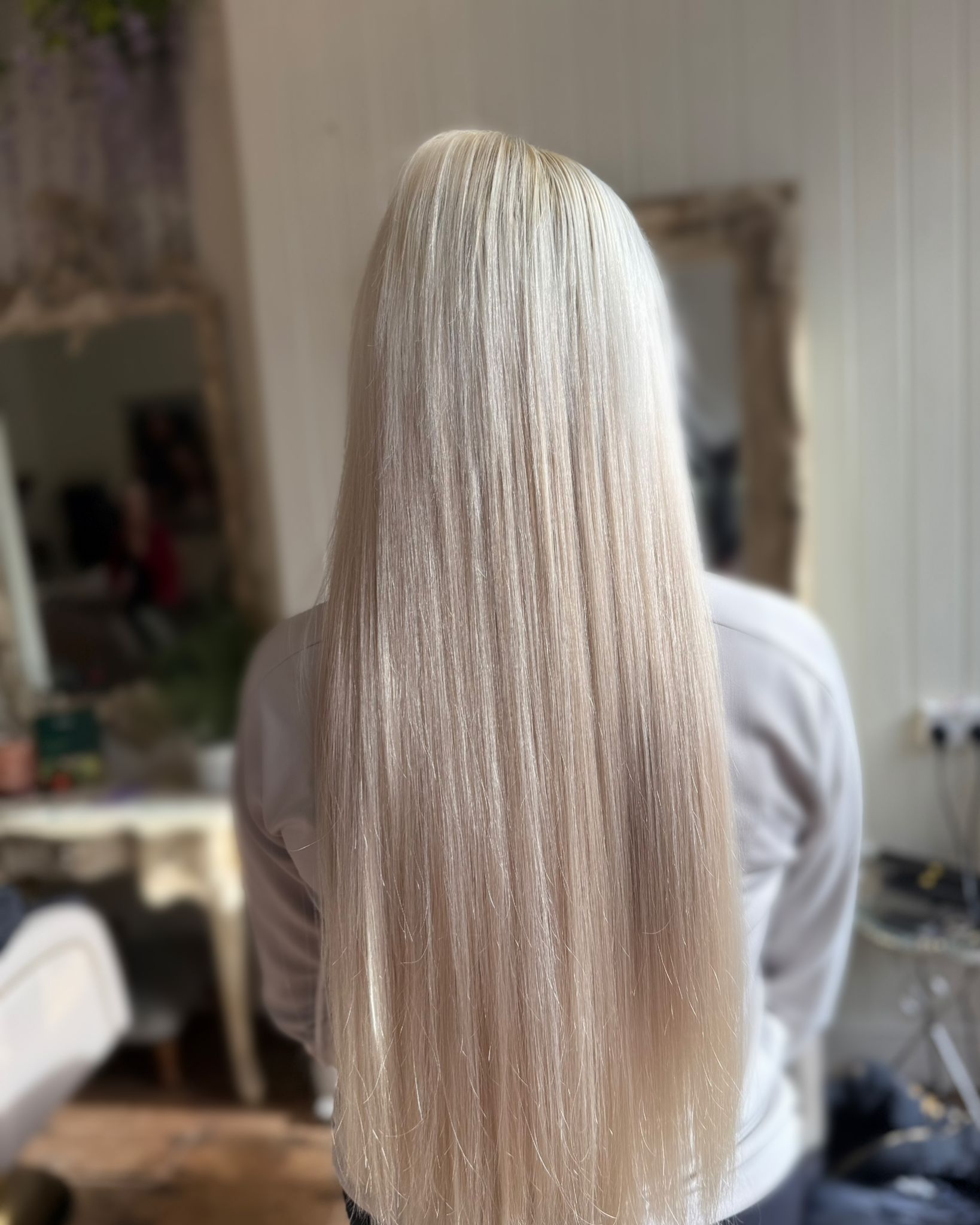 Hair extensions applied by Looks by Lexie for added length and volume